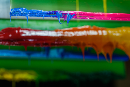 colorful of plastisol ink stick on printer handle start flowing downの写真素材