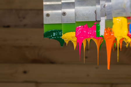 colorful of plastisol ink stick on printer handle start flowing downの写真素材