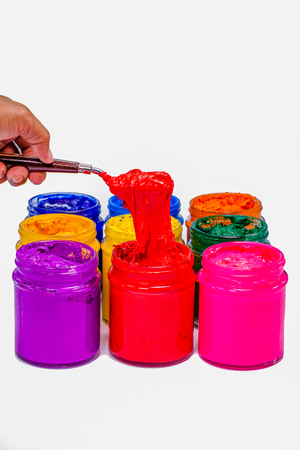 Use trowel scoop red color of Plastisol ink from the cans.Plastisol ink useful for print tee shirtの写真素材