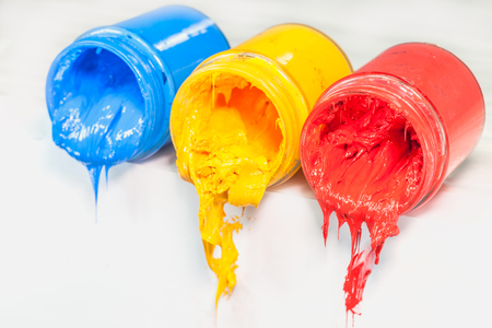 yellow blue and red colors of Plastisol ink on white table. Plastisol ink for print tee shirt and any fabric useful in tee shirt factory. yellow blue and red colors are primary color.の写真素材