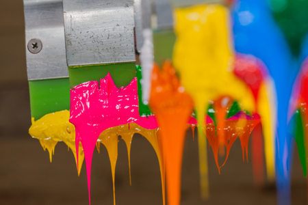 colorful of plastisol ink stick on printer handle start flowing downの写真素材