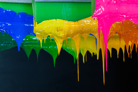 colorful of plastisol ink stick on printer handle start flowing downの写真素材