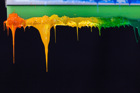 colorful of plastisol ink stick on printer handle start flowing downの写真素材