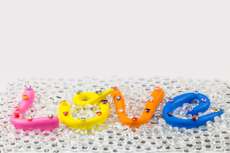 L in pink color O in yellow color V in orange and E in blue color. the word love in colorful alphabet decorate with diamonds for valentine day.の写真素材