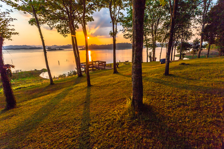Stunning panoramic view of the lake in sunset time. light through the sky to the lakeの写真素材