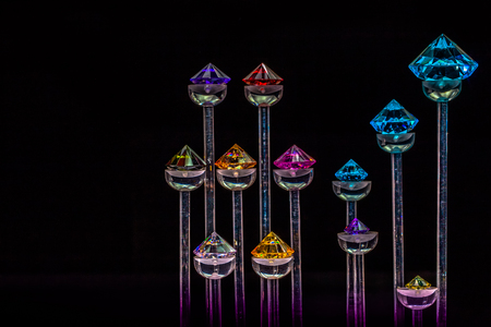 colourful diamonds are on display in black backgroundの写真素材