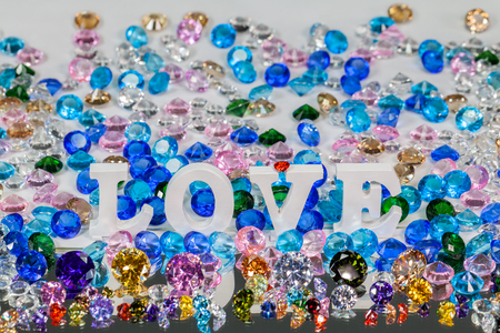 The word love is located on the area of colorful diamonds and.  the word love is love for Valentine's Day.の写真素材