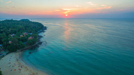 aerial view the sun going down to holison at Karon beach Phuket two jet boats sail in Karon sea during sunsetの写真素材