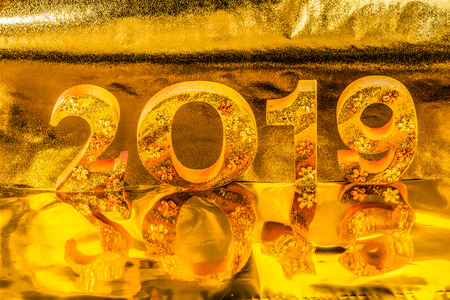 2019 is made in gold color place in golden background is mean the golden year for lucky all yearの写真素材