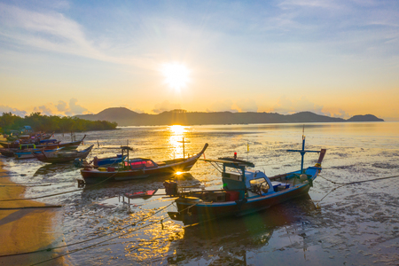 Aerial view fishing boats parking on the mud near the shipyardの写真素材