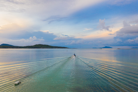 aerial view long tail fishing boat sailing to the sea at Rawai seaの写真素材