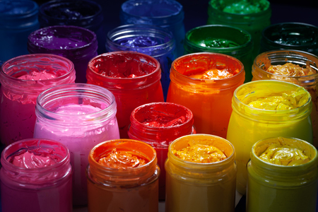red color of screen printing ink for print on tee shirts and fabric. plastisol ink useful in tee shirt factory and textile for exporの写真素材