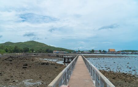 The Samae San Pier Bridge is long and connects to the pier to Samae San Island. You can walk to see coral reefs and fish in the tide.の写真素材
