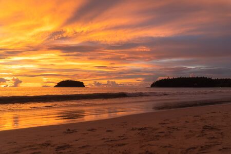 Kata Beach is a beautiful beach with white sand and smooth waves perfect for relaxing and swimming. There is a unique Pu island close to Kata  beach.の写真素材