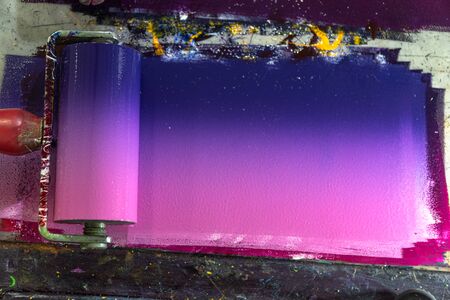 Mixing colors using a roller to rotate colors so that each color is blended together and then...