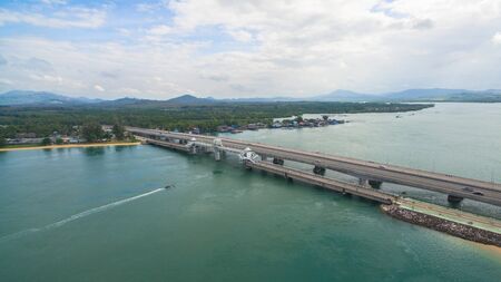 aerial view Sarasin bridge connect Phang Nga province to Phuket island. The old bridge was renovated to be a tourist attraction and a viewpoint in the middle of the sea.の写真素材