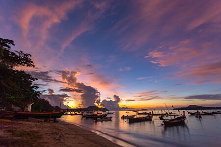 beautiful sunrise above fishing boats on Rawai beach, Phuket,Thailand.