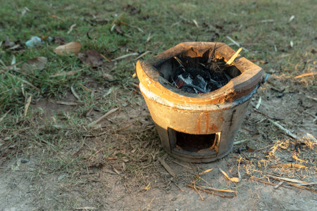 Way of life of rural people Make a fire with dry twigs, dry leaves next to the house to bbq fresh fishの写真素材