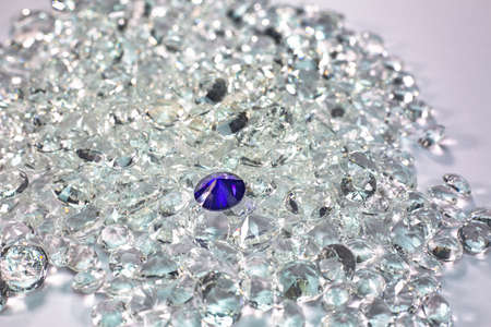 Blue diamonds are placed on a pile of white diamonds And keep turning.の写真素材