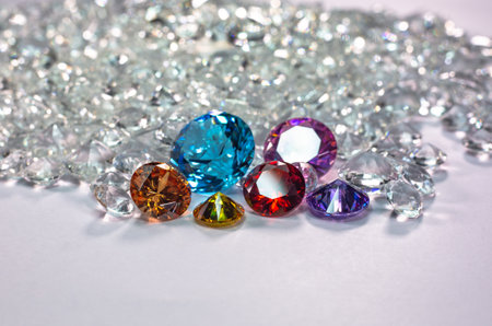 colorful diamonds are placed on a pile of white diamonds And keep turning. video 4k resolution shoot...
