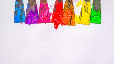 blue ,purple, pink, red,orange, yellow and green are slowly dripping from color scoop handle.and...