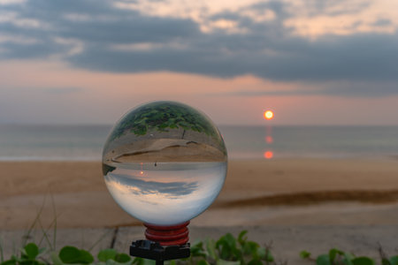 sunset in crystal ball the image that appears in an upside-down looks strange.