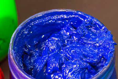 close up blue color of ink for print tee shirt in the glass bucket.
colorful of blue ink background.の写真素材