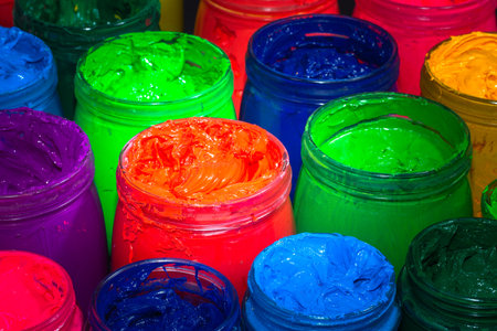 the red of plastisol ink for print tee shirt in the glass bucket. colorful of ink background.の写真素材