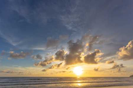 Majestic sunset or sunrise landscape Amazing light of nature cloudscape sky and Clouds moving away rolling 
Beautiful Phuket beach is a famous tourist destination in Andaman sea summer. 
colorful dark sunset clouds.の写真素材
