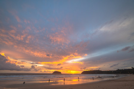 Scene of Colorful romantic sky sunset with Changing the color of the sky background . 
beautiful cloud at sunset above island in nature and travel concept.の写真素材
