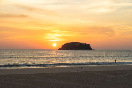 scenery yellow sky the sun going down to the sea.
beautiful golden sky at sunset in Kata beach Phuket Thailand
high quality image for travel concept.の写真素材
