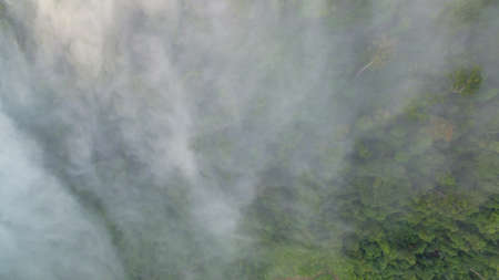 aerial view mist above the mountain in tropical rainforest and beautiful sunrise scenery view in...