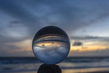 beautiful sky in sunset above the sea. The beautiful view of sunset in a crystal ball looks like no other. 4K Videos for beautiful and unusual travel ideas.の写真素材