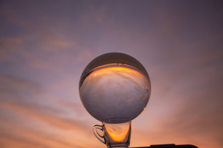 view of colorful nature at sunset inside crystal ball.
beautiful sunset over sea in a crystal ball on the beach. 
Nature High quality footage in nature and travel concept.の写真素材