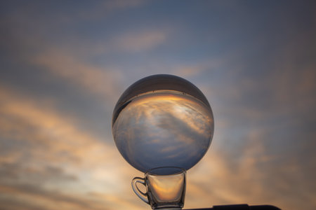 view of colorful nature at sunset inside crystal ball.
beautiful sunset over sea in a crystal ball on the beach. 
Nature High quality footage in nature and travel concept.の写真素材