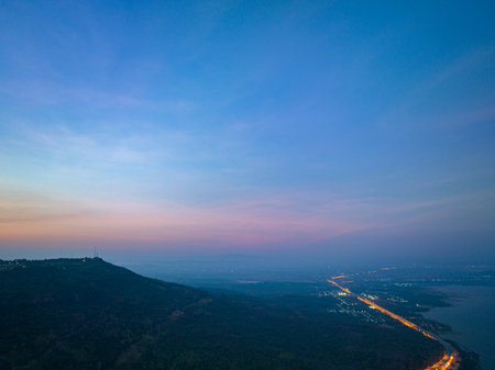 aerial view orange lights on the expressway along the route along the Lam Ta Khong Dam.beautiful scenery in the early morning wind mill on the mountains, rivers and sweet skies background.の写真素材