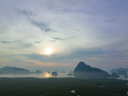 aerial view Amazing light of nature cloudscape sky above Samed Nang Chee Phang Nga archipelago. 
Imagine a fantasy bright red sky at sunrise from a bird's eye view.
tropical landscape background.の写真素材