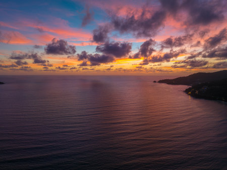 Drones take pictures of the beautiful sky by the beach in stunning sunset.
colorful sky in sunset above Patong city at twilight. 
Scene of romantic sky sunset background.の写真素材