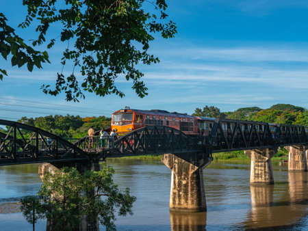 The train is passing through the Death Railway Bridge over the River Kwai in Kanchanaburi. 
During World War Two Japan constructed railway from Thailand to Burma This is now know the Death Railway.の写真素材