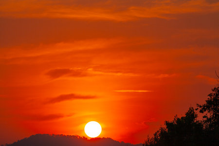 Amazing sky at sunset. Gradient color. Sky texture, abstract nature background.
Sunset with red color light rays and other atmospheric effects.
Big sunset and sweet lighting sky. phone antenna post.の写真素材