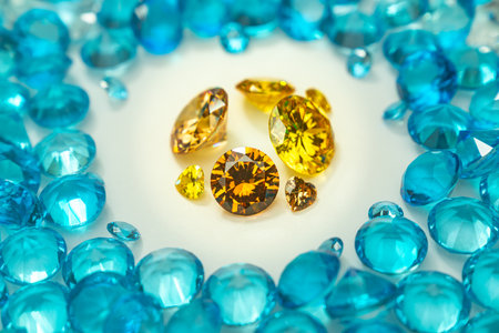 A group of Golden diamonds arranged in a row in front of white diamonds on a white background.
Yellow heart diamond put on white background.
video 4k.high quality video 4K raw blue stones background.の写真素材