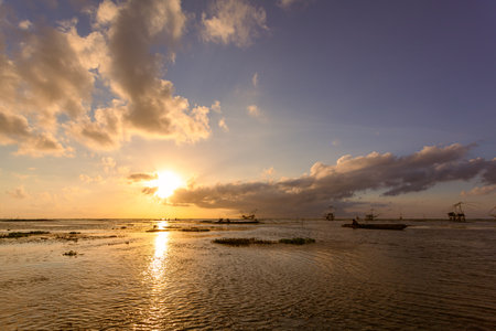 Beautiful golden reflection sunrise above the lagoon.
landscape Amazing yellow light of nature cloudscape sky background.
Scene of romantic sky sun shine throughthe cloud.の写真素材