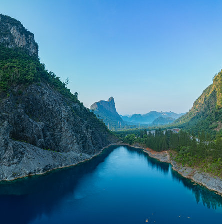 Aerial view large pond There is blue water and the pine forest has a beautiful view like...