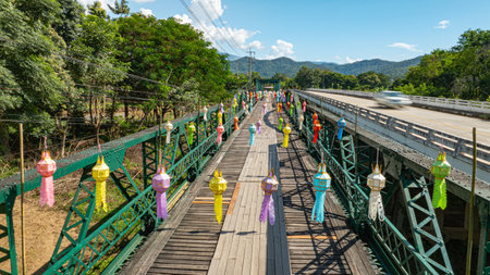 Aerial view of The Ta Pai Memorial Bridge is like the gateway to Pai. It is a bridge with a dark green steel frame and wooden floor spanning the Pai River. It was built during World War II.の写真素材