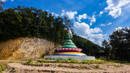 A vibrant stupa in the shape of a lotus, featuring intricate green, pink, and yellow details, set...