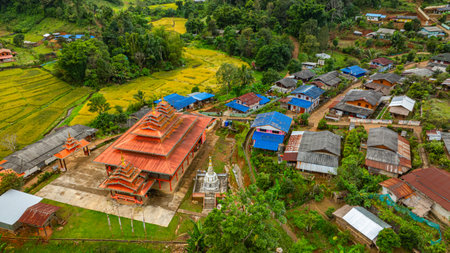 Aerial view of The entrance to Pang Ung Dam has rice terraces along the way, which looks beautiful and blends in with nature. Wat Baan Hai Makhuea Som is a temple and center of the local people.の写真素材