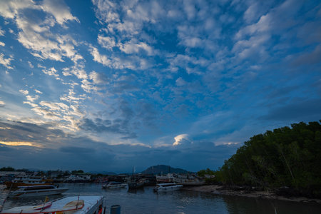 white clouds in the blue sky The sun shines through. birds flying in the sky The wind that blows...