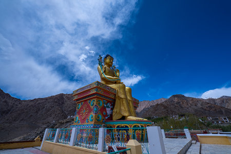 Guardians of the Past Likir Monastery and the Golden Maitreya.Standing tall amidst Ladakhâs stark beauty, the magnificent Maitreya Buddha statue at Likir Monastery radiates peace and promise.の写真素材