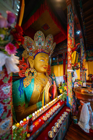 Beautiful and respectful golden buddha statue. Maitreya Buddha statue in Thiksey Monastery is 15 m high magnificent statue. It is the largest such statue in Ladakh covering two stories of the buildingの写真素材