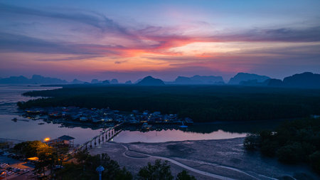 Aerial view of scenery sky reflection at Bang Phat fishing village at twilight. Reflection of the...